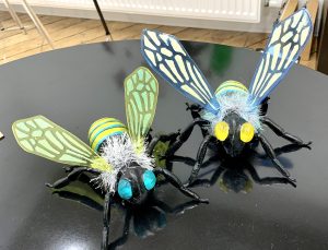 two bee sculptures